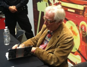 Glyn Johns autographs a book at Saturdays Rock Hall event.